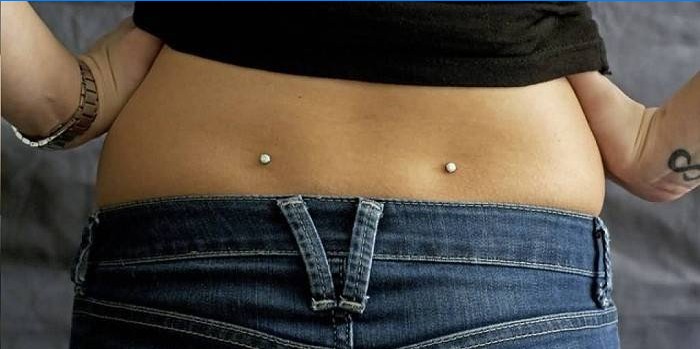 Piercing i korsryggen